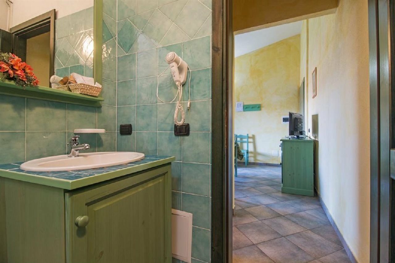 Albergo Residenziale Gli Ontani Cala Liberotto Bagian luar foto